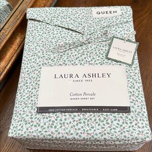 Laura Ashley Queen Cotton Percale sheets in the Holly Jolly Green Pattern.